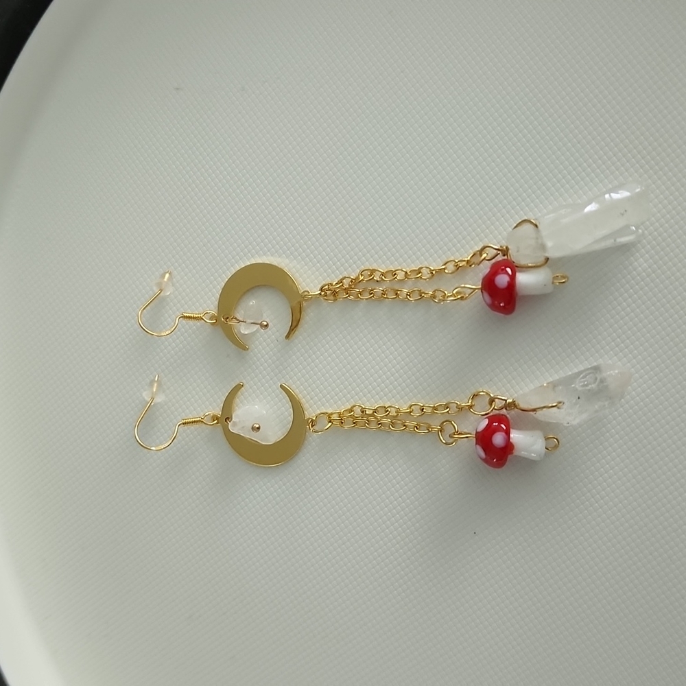 Gold tone moon, crystal and mushroom dangle earrings